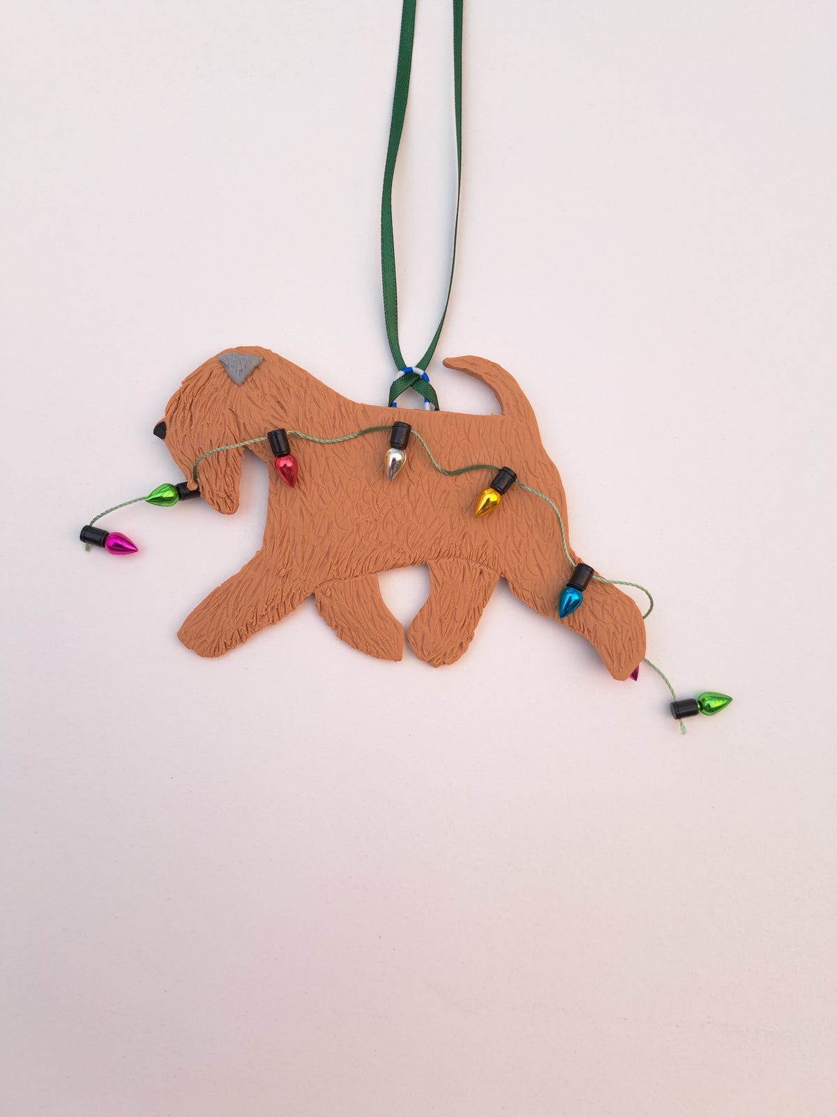 Wheaten Terrier Running With Christmas Lights Decoration