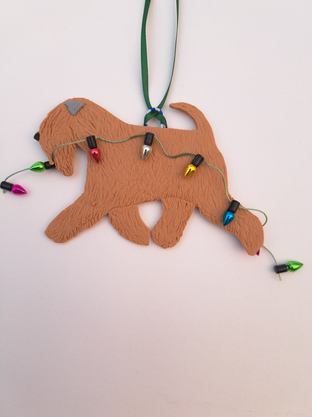 Wheaten Terrier Running With Christmas Lights Decoration